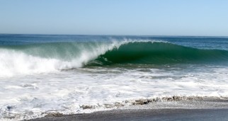 High tide pushing up the beach. 