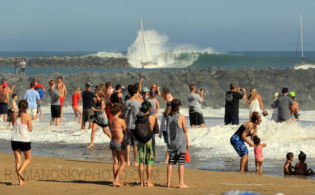 The height of this wave breaking in the harbor entrance usually indicates an epic swell seen perhaps once every 3 or 4 years.   Accordingly the set waves at Wedge should have exceeded 30 feet in face height (the largest this swell may have been twenty).  Note: Photographing such a wave from the Wedge jetty’s rocks, without the people, remains a quest.